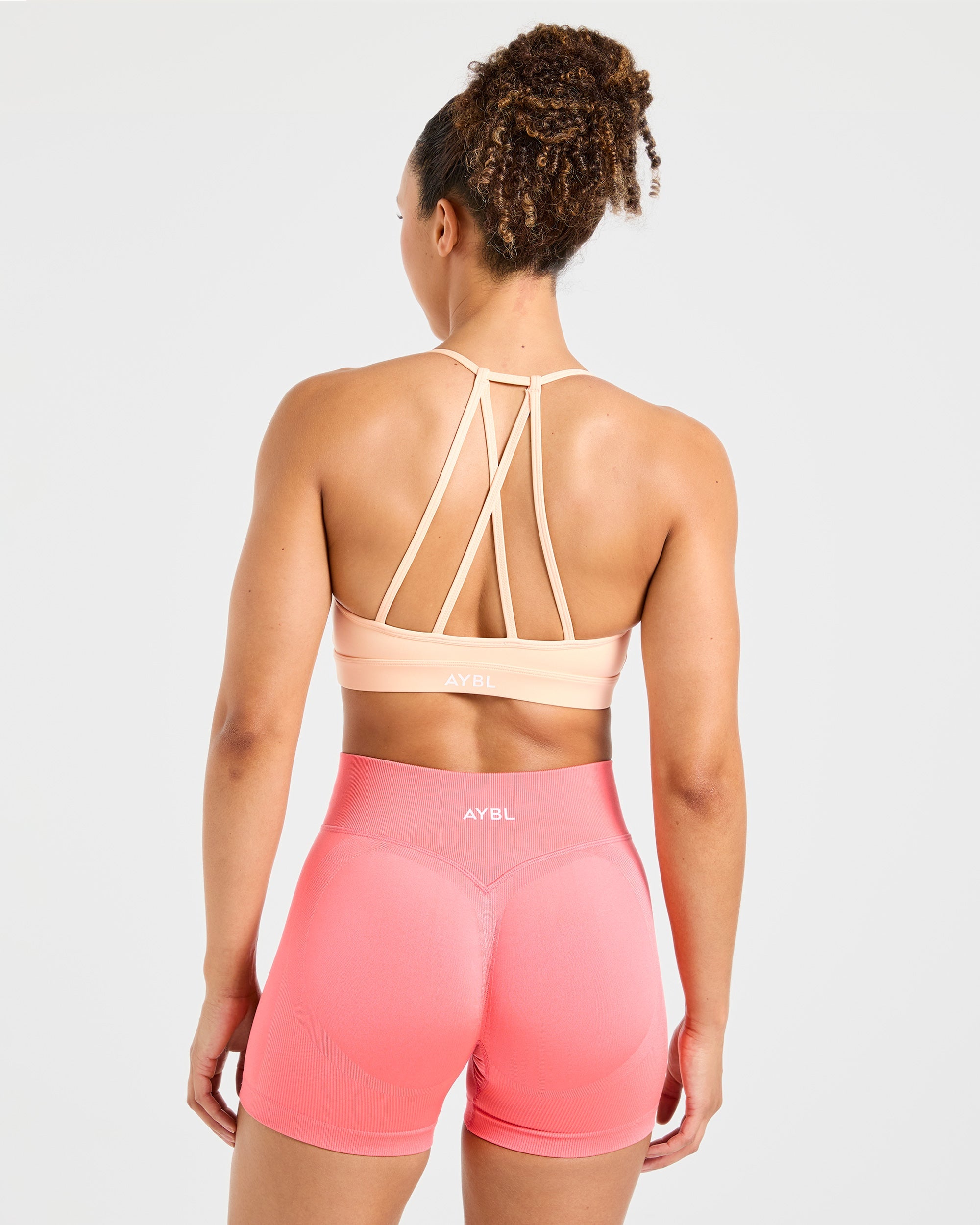 Sports Bra Essenziale con Scollatura a V e Cinturini - Pesca Pastello