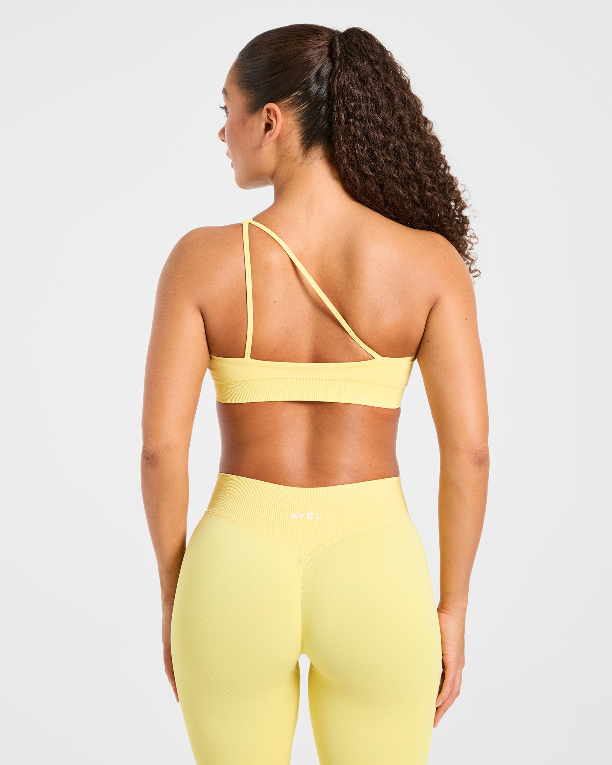 Aumenta il tuo look con lo Sports Bra monospalla senza cuciture - Giallo acceso